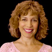 Smiling woman with shoulder-length light brown hair